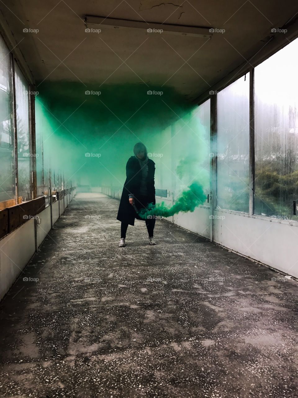 A woman holding green distress flare