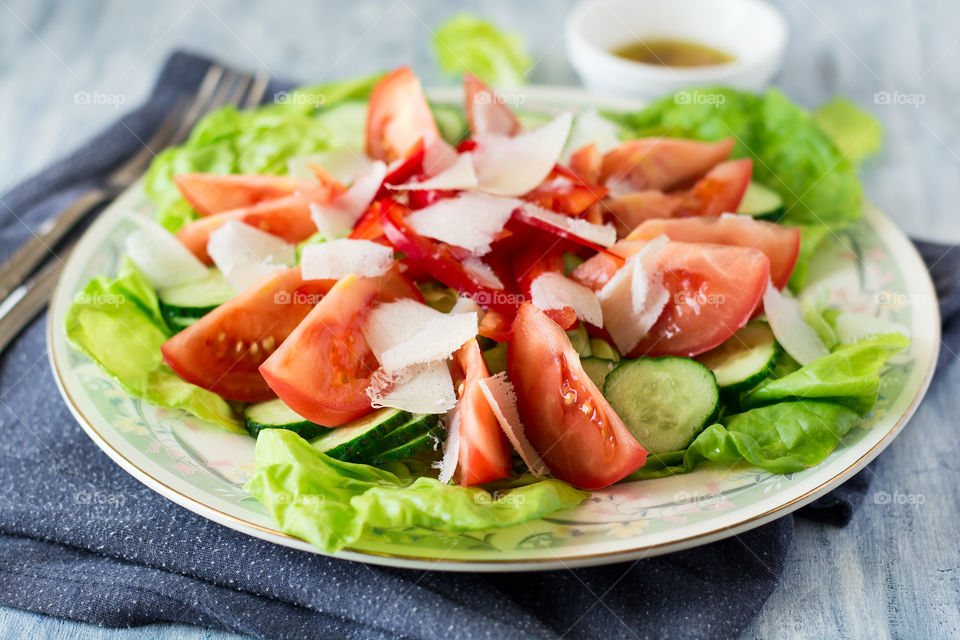 Salad with tomatoes pepper, cucumber and lattuce leaves