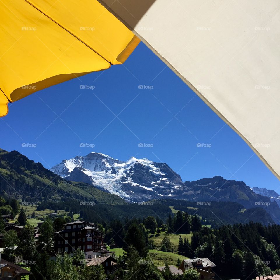 Stunning view of the Jungfrau and Silberhorn peaks, which are framed perfectly by umbrellas!!