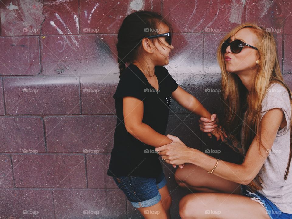 Mother hand holding her daughter