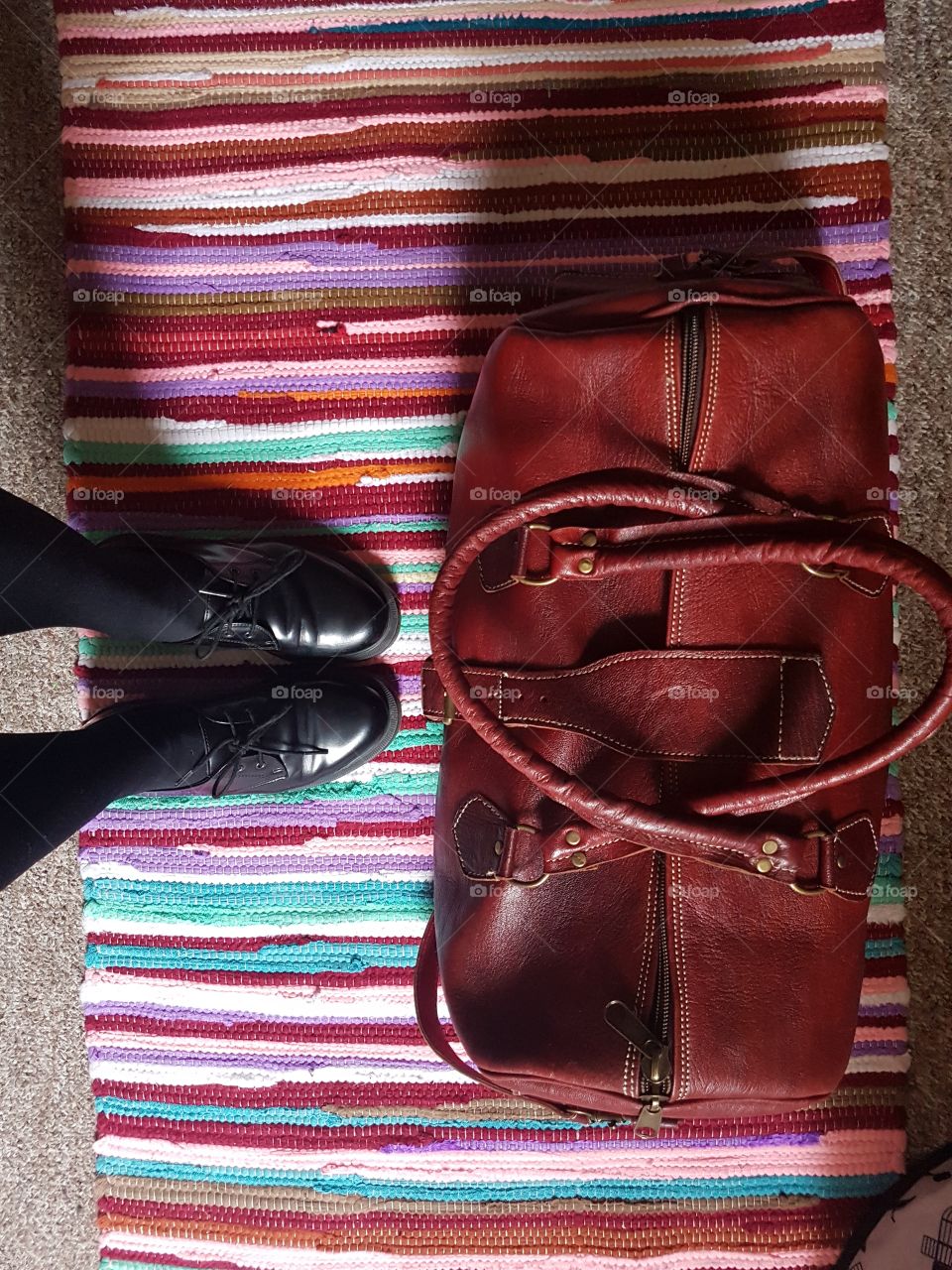 Travel bag, feet shot.