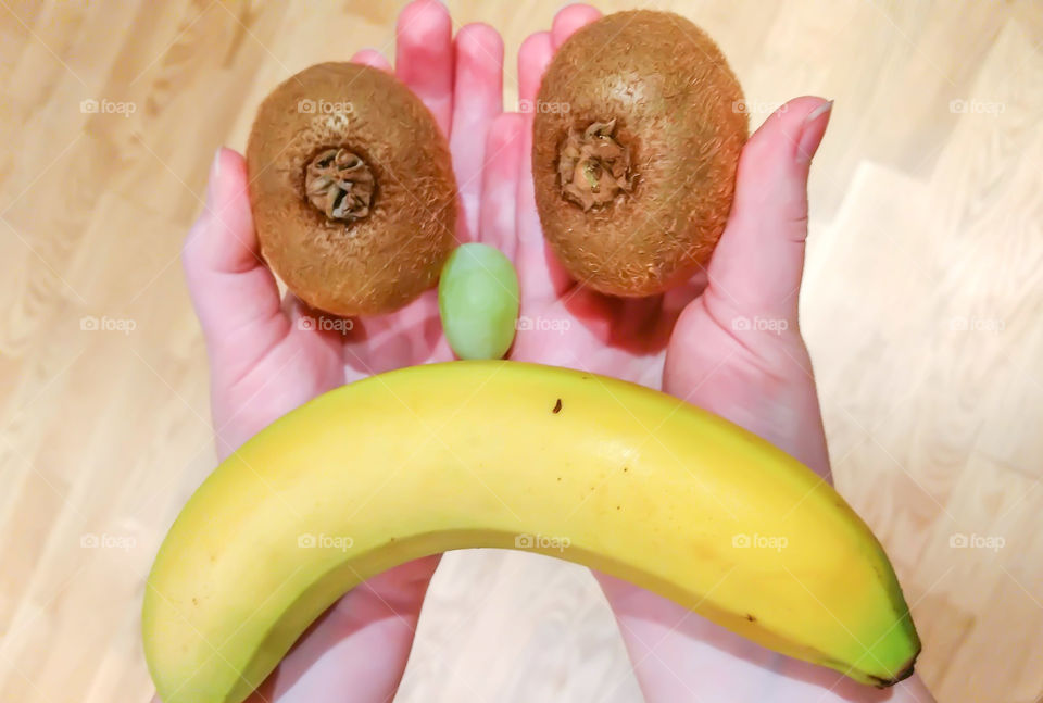 Human hand holding fresh fruits
