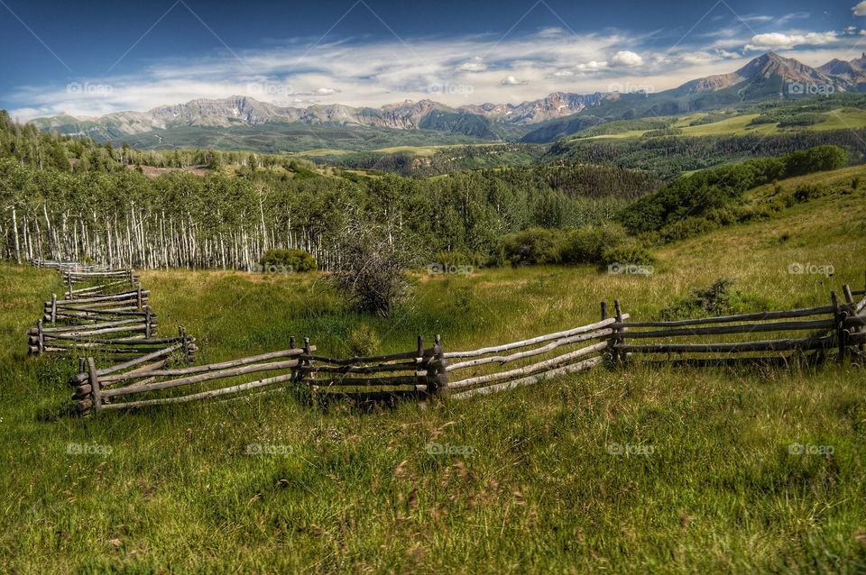 Scenic view of grassy landscape and mountain