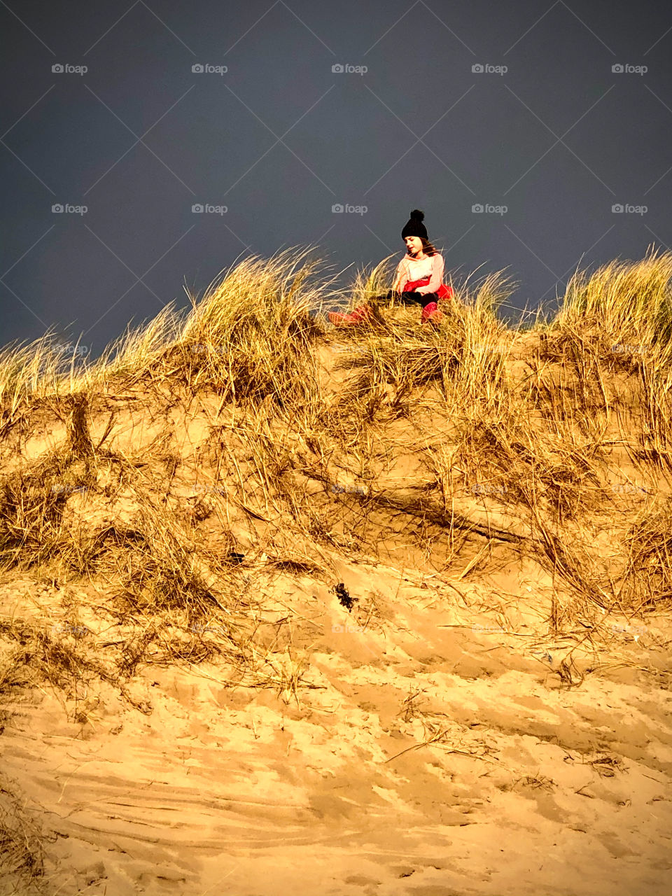 Girl on sand dune