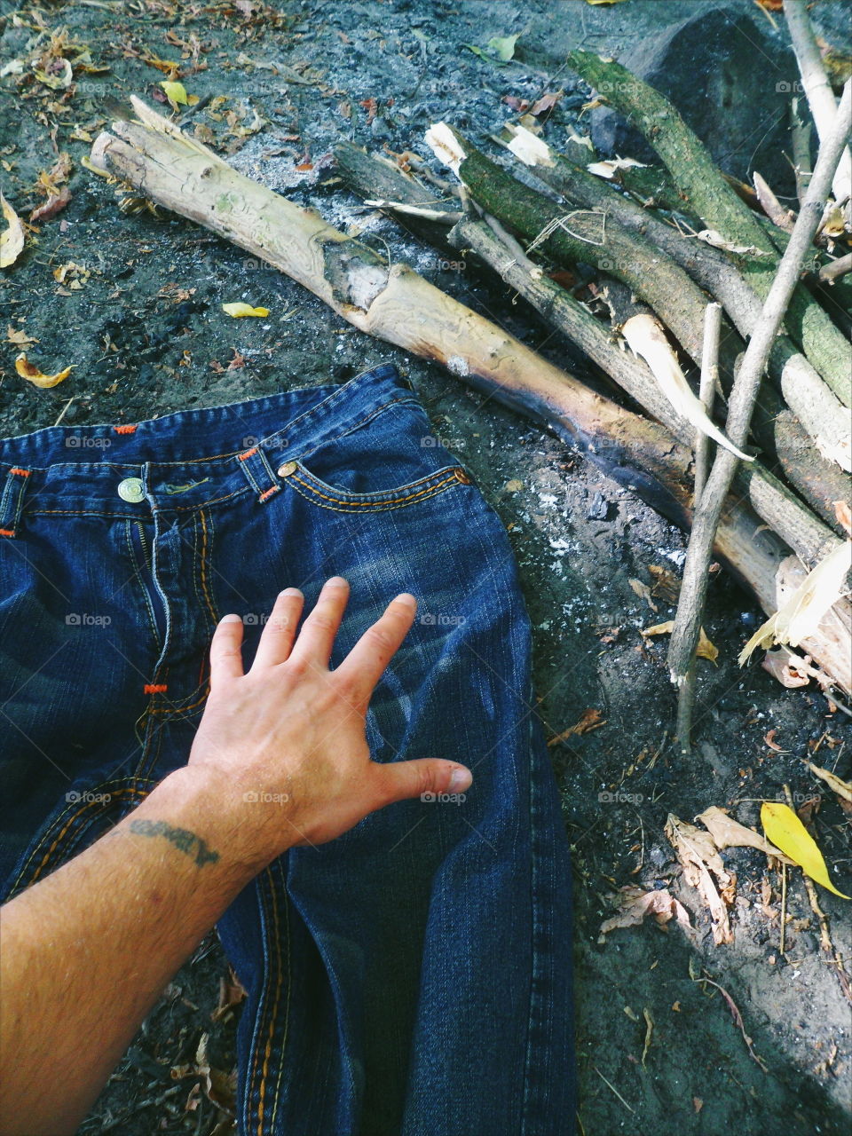 jeans lie near the extinct fire