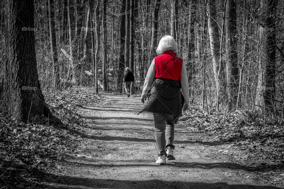Woman on a trail with color burst