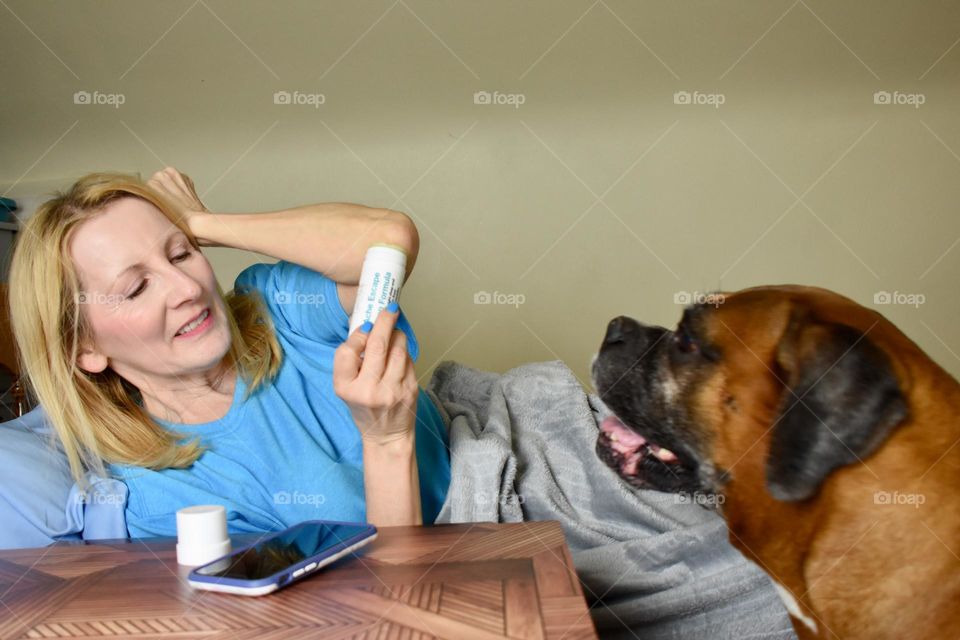 Mother applying ointment before going to bed