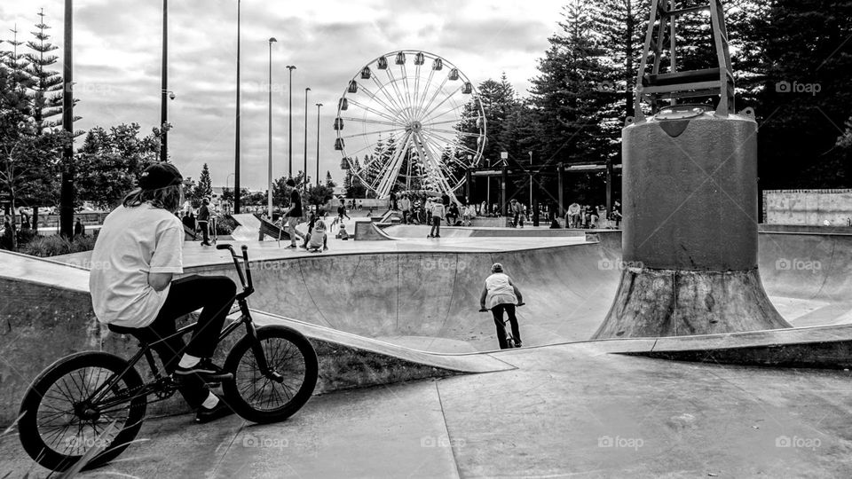 Action at the skate park with ferris wheel views!