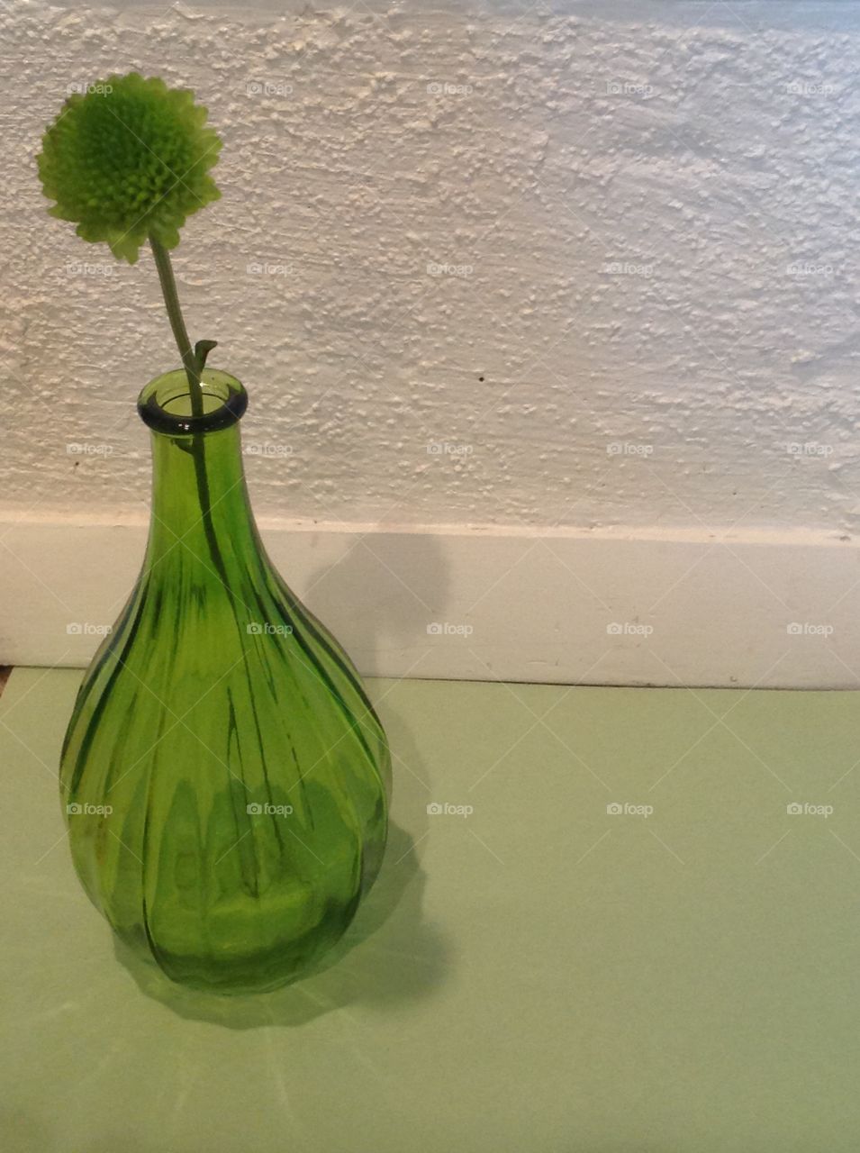 A green glass vase.