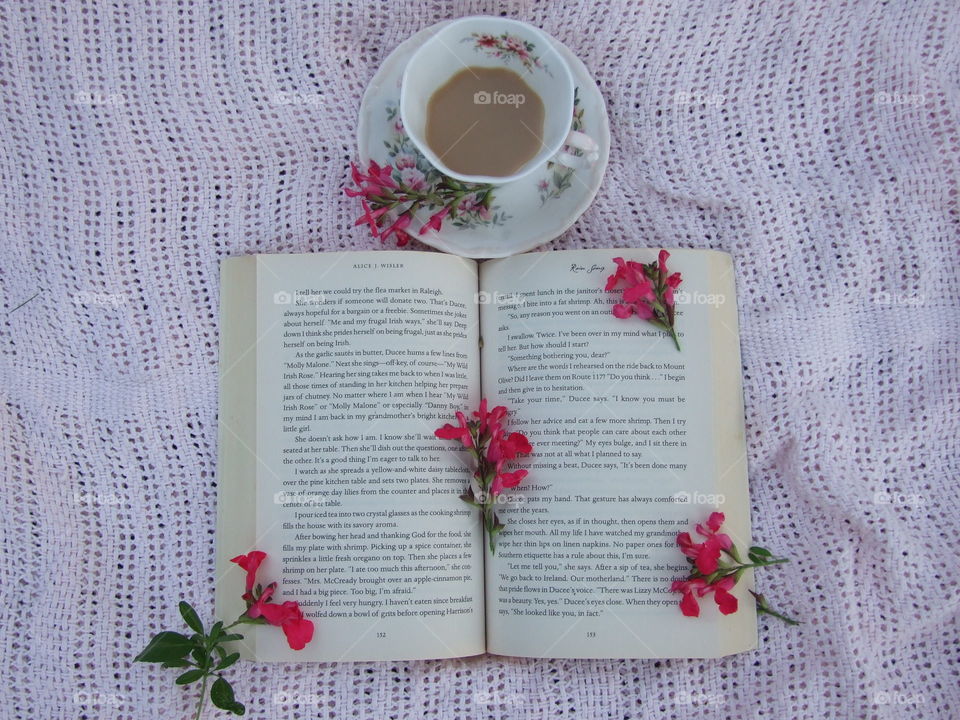 Tea, book, and blossoms