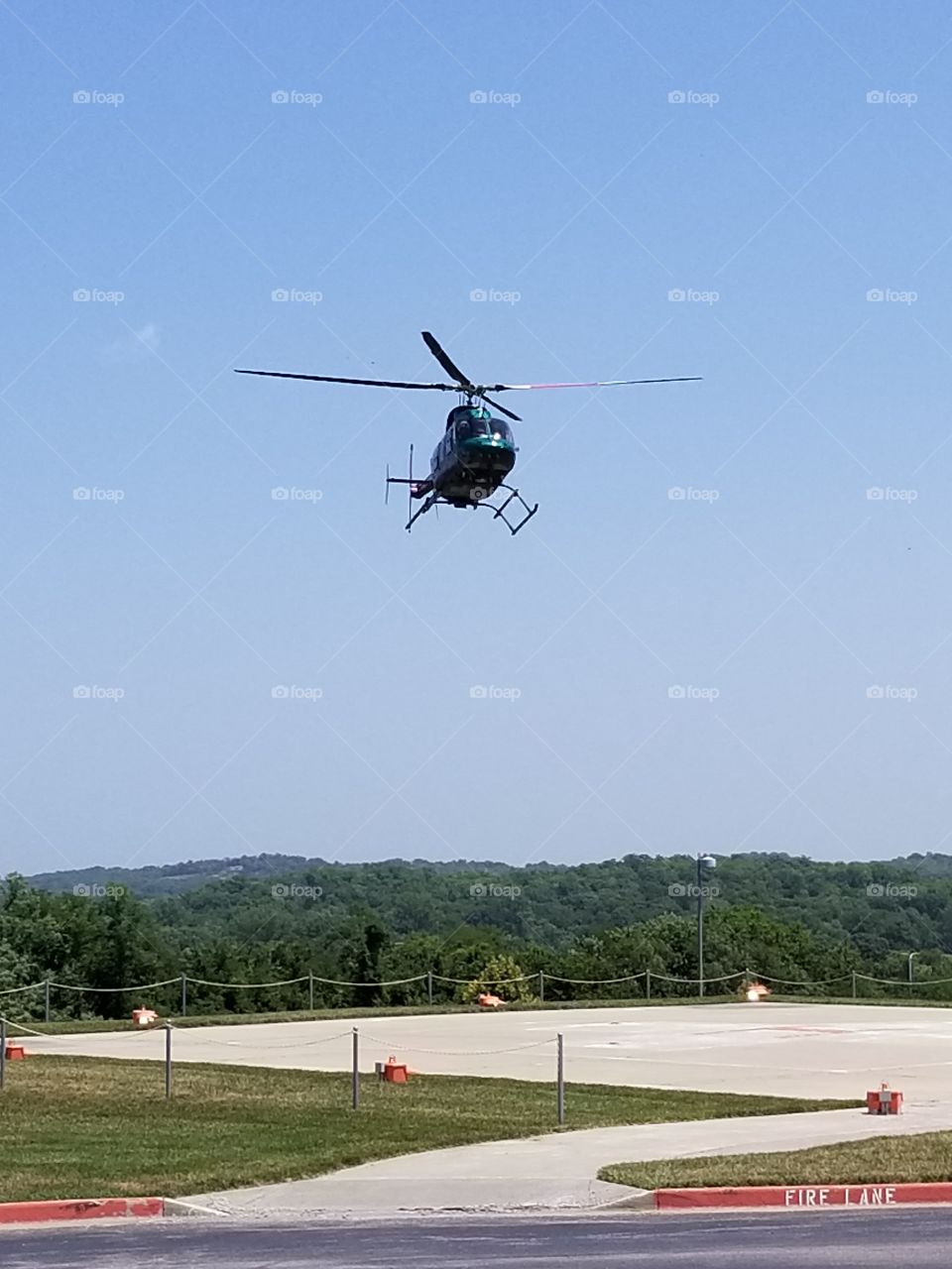 Medical Helicopter landing at hospital.