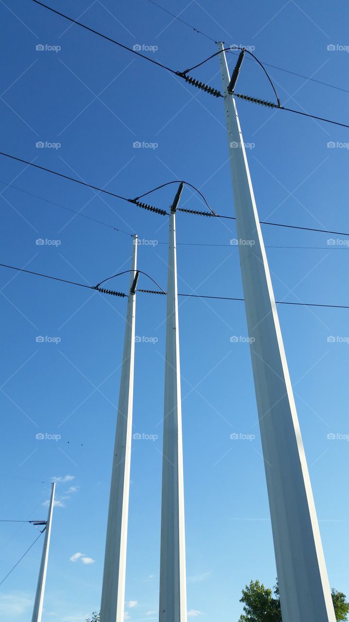 white poles blue sky