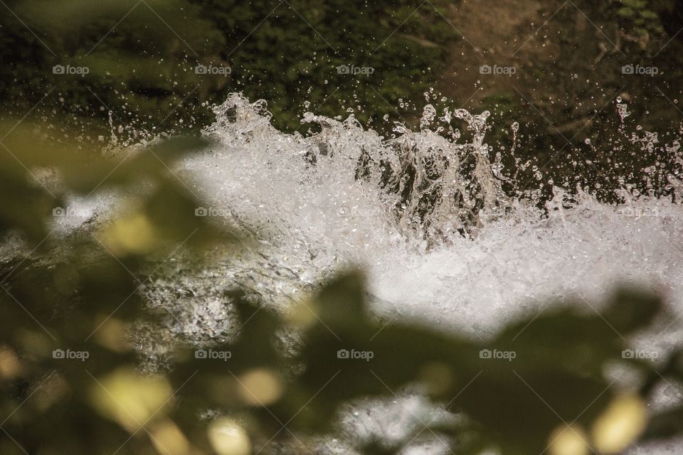 Flowing water a top a waterfall