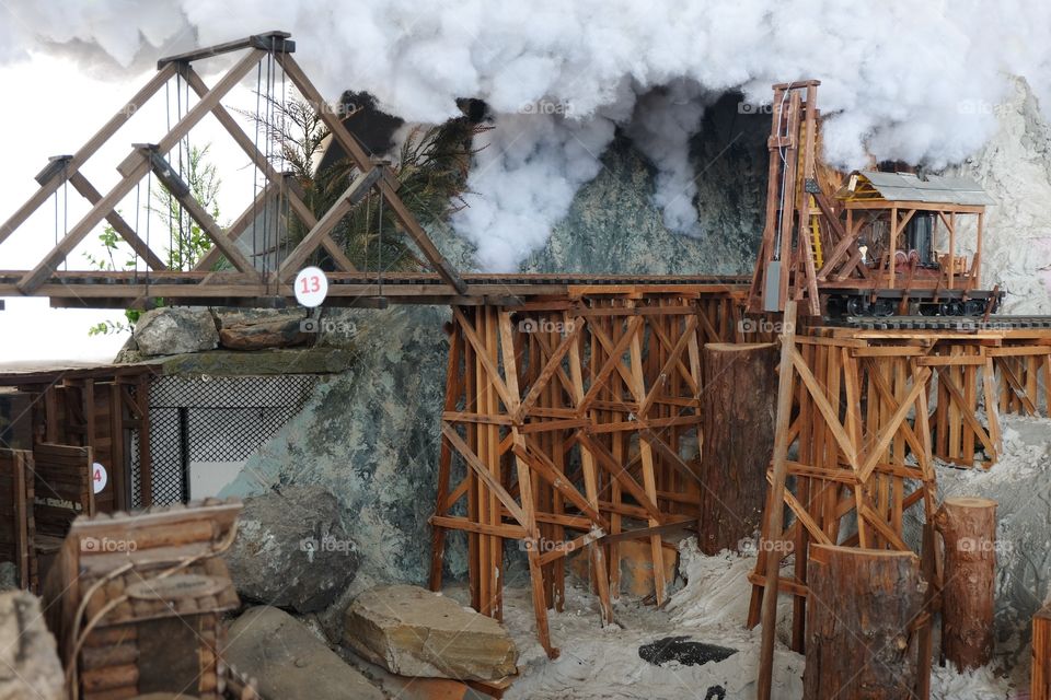 Miniature train tracks, trellise bridge, kids attraction