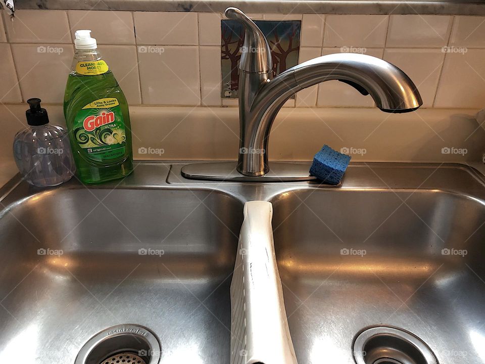 Ready to wash dishes, sink in the kitchen, dishwashing perspective, first person perspective, washing dishes by hand 