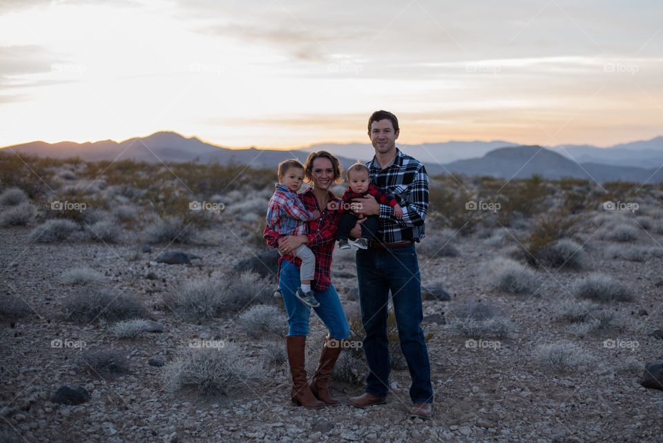 American Family in flannel in the desert sunset