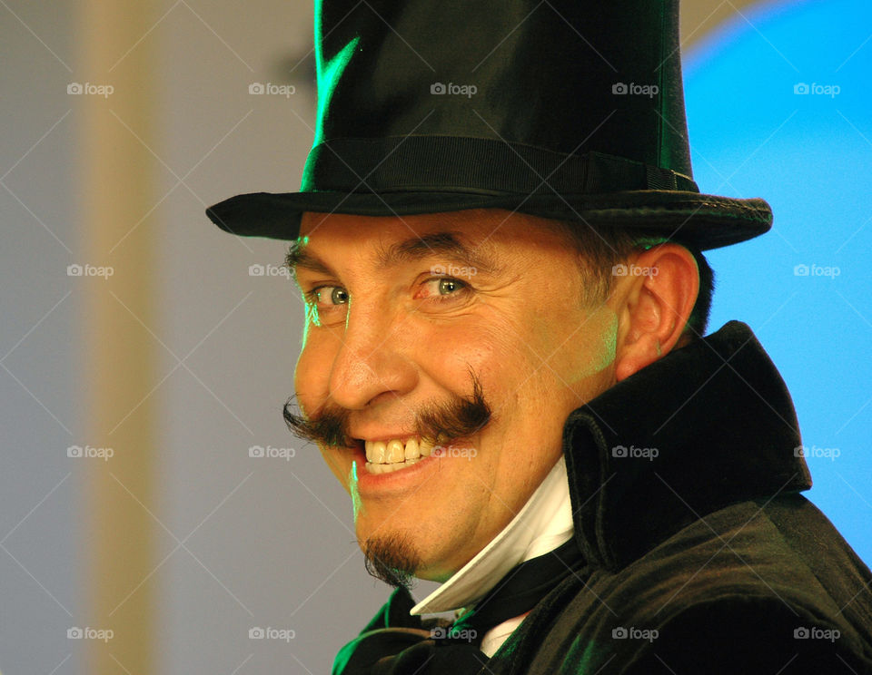 Close-up trendy man in black hat