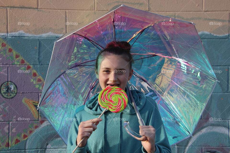 Girl holding Iridescent umbrella