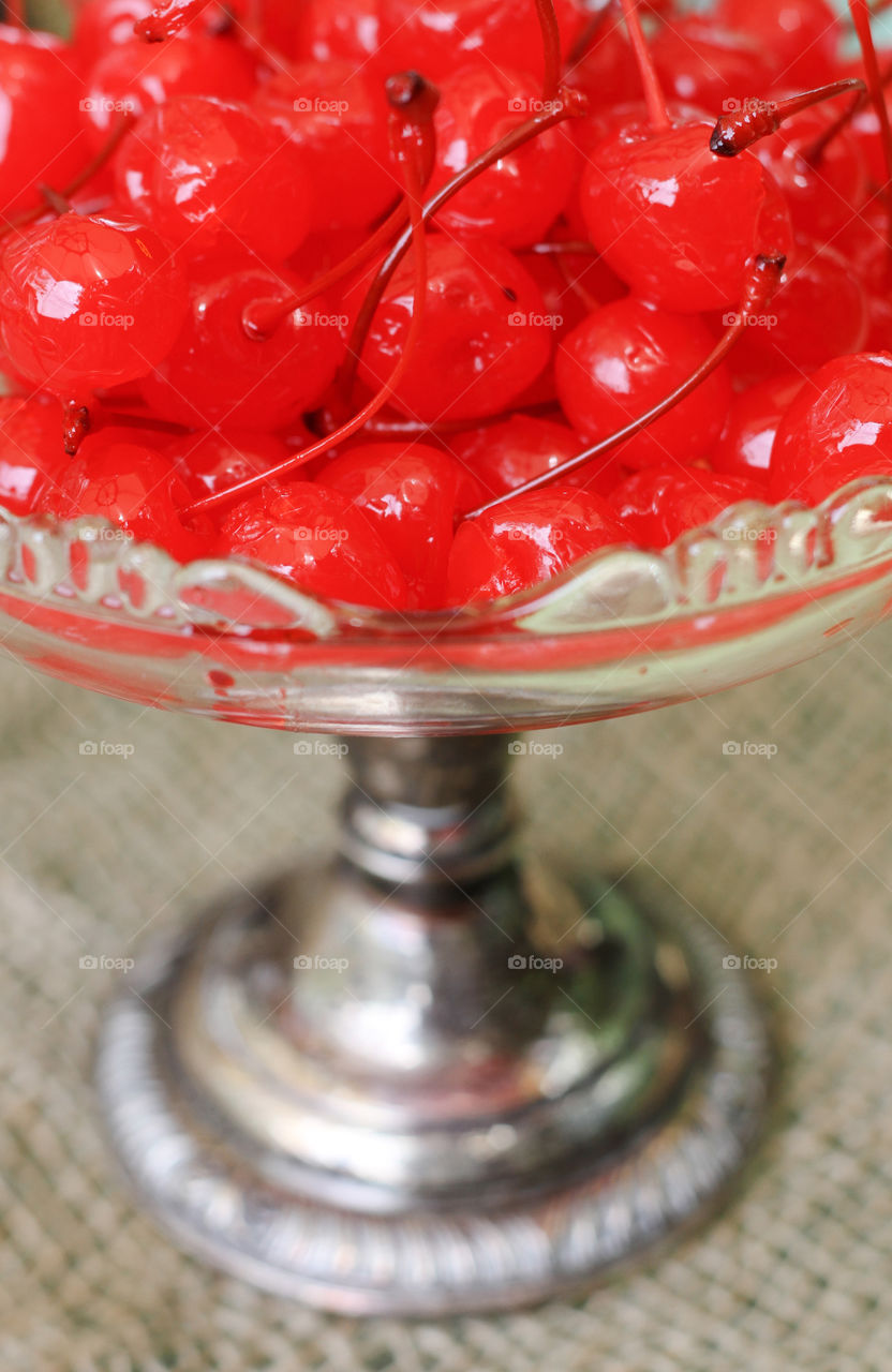 Marachino cherries in a vintage clear glass platter