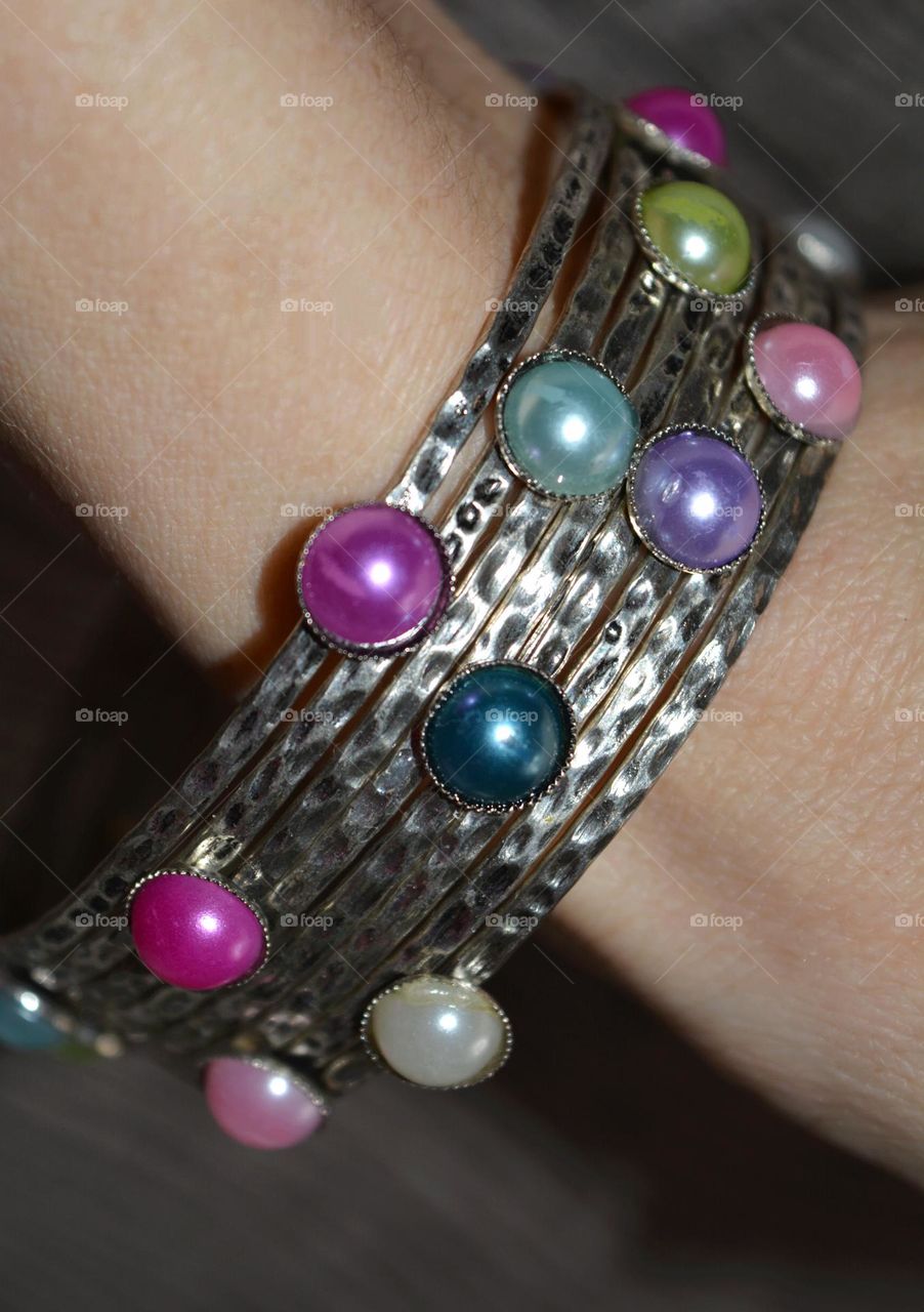 female hand with colour bracelet, beautiful accessories woman