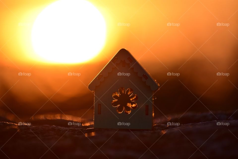 wooden house on sunset background