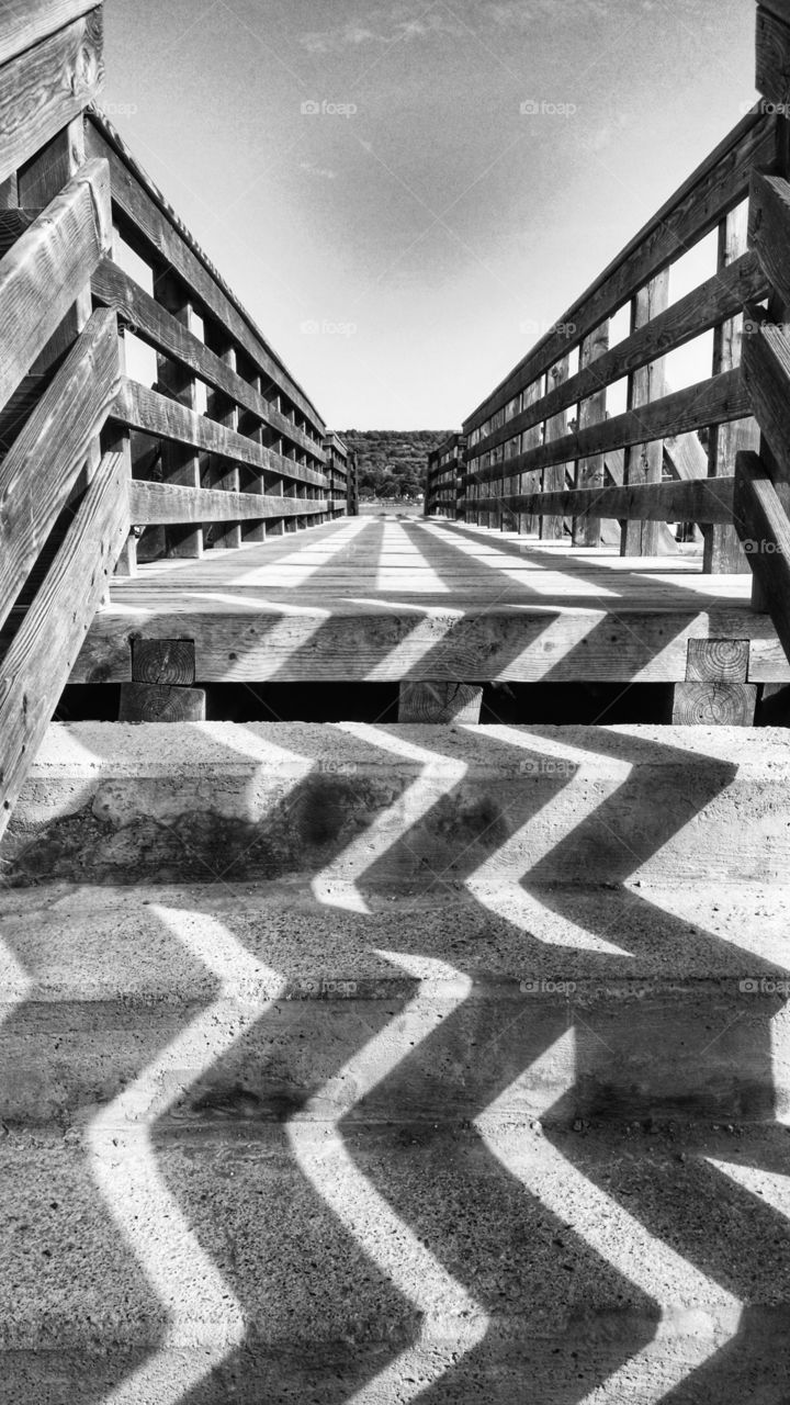 Black and white geometry at noon on the steps.