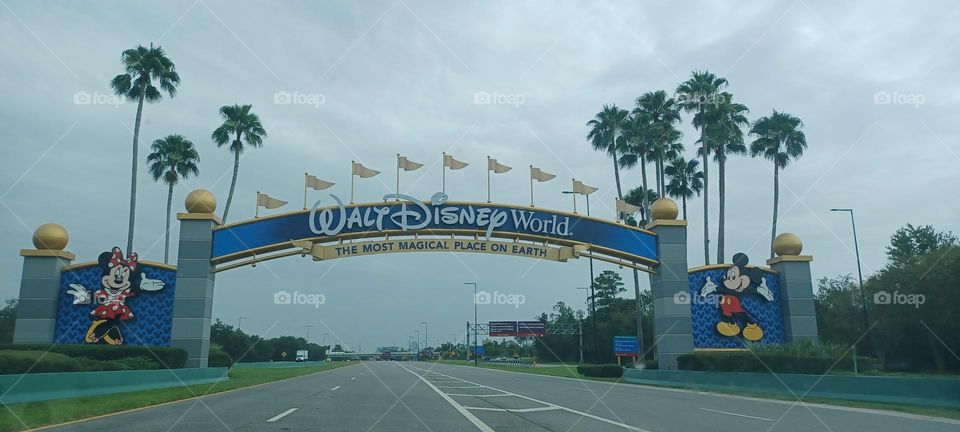 Arched welcome sign of the entrance of Disney parking areas 