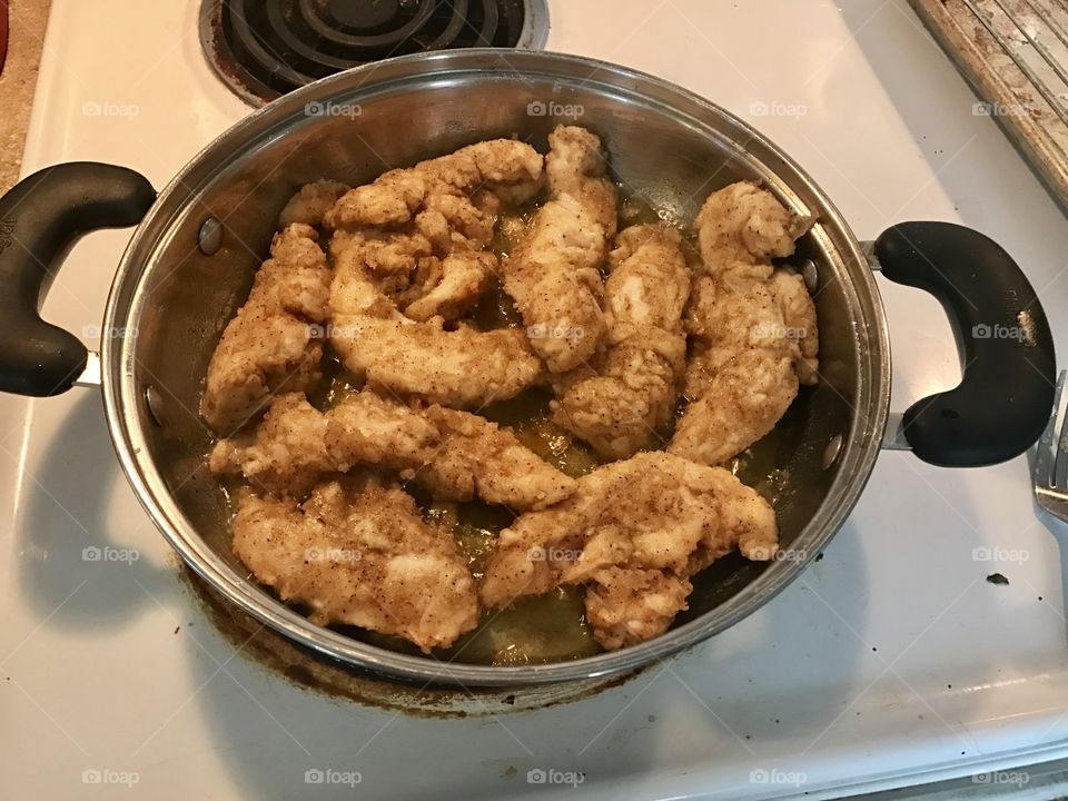 A bowl of fried chicken tenders 