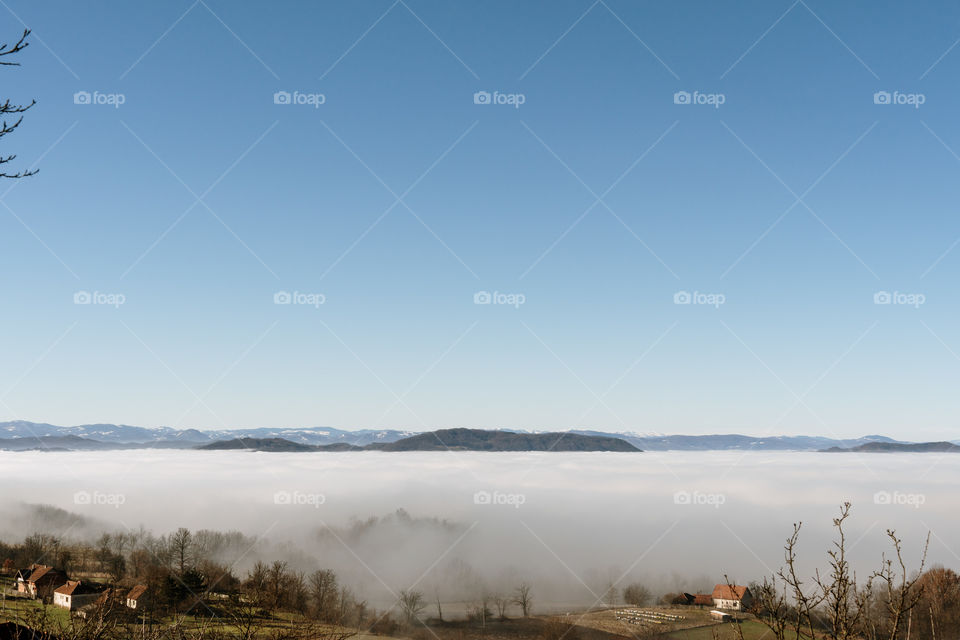 Rural landscape with dense fog