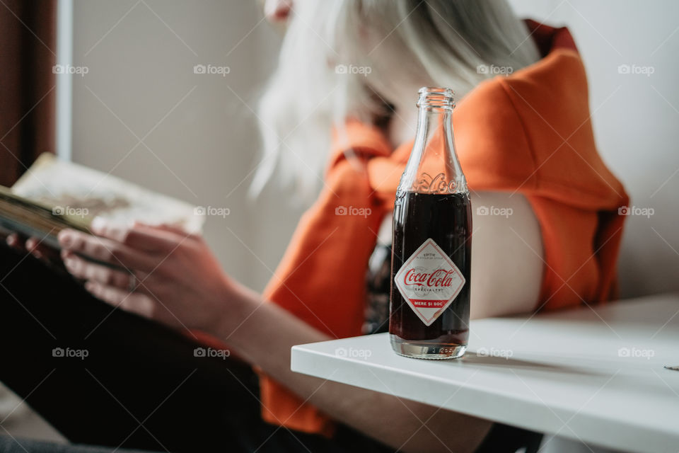 blond girl chilling with coca cola