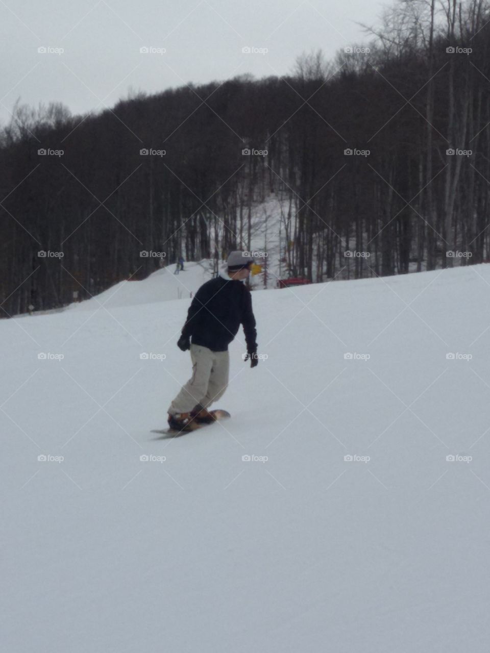 skier on snowboard