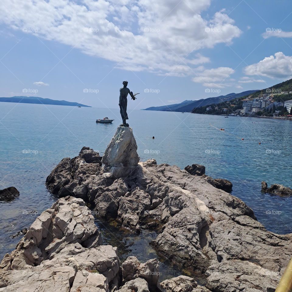 statue holding bird in Opatia