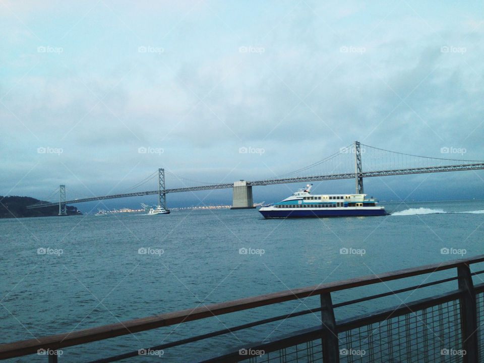 BOAT BY BAY BRIDGE