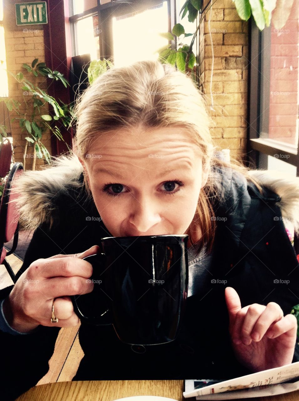 Young woman drinking coffee