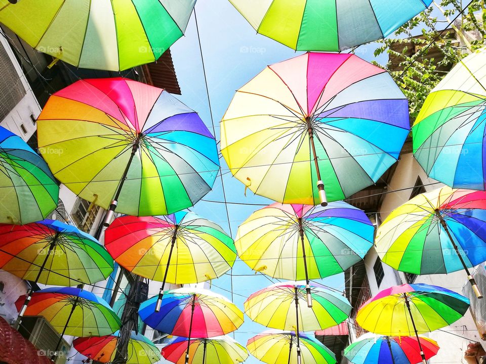 Background of colorful hanging umbrellas