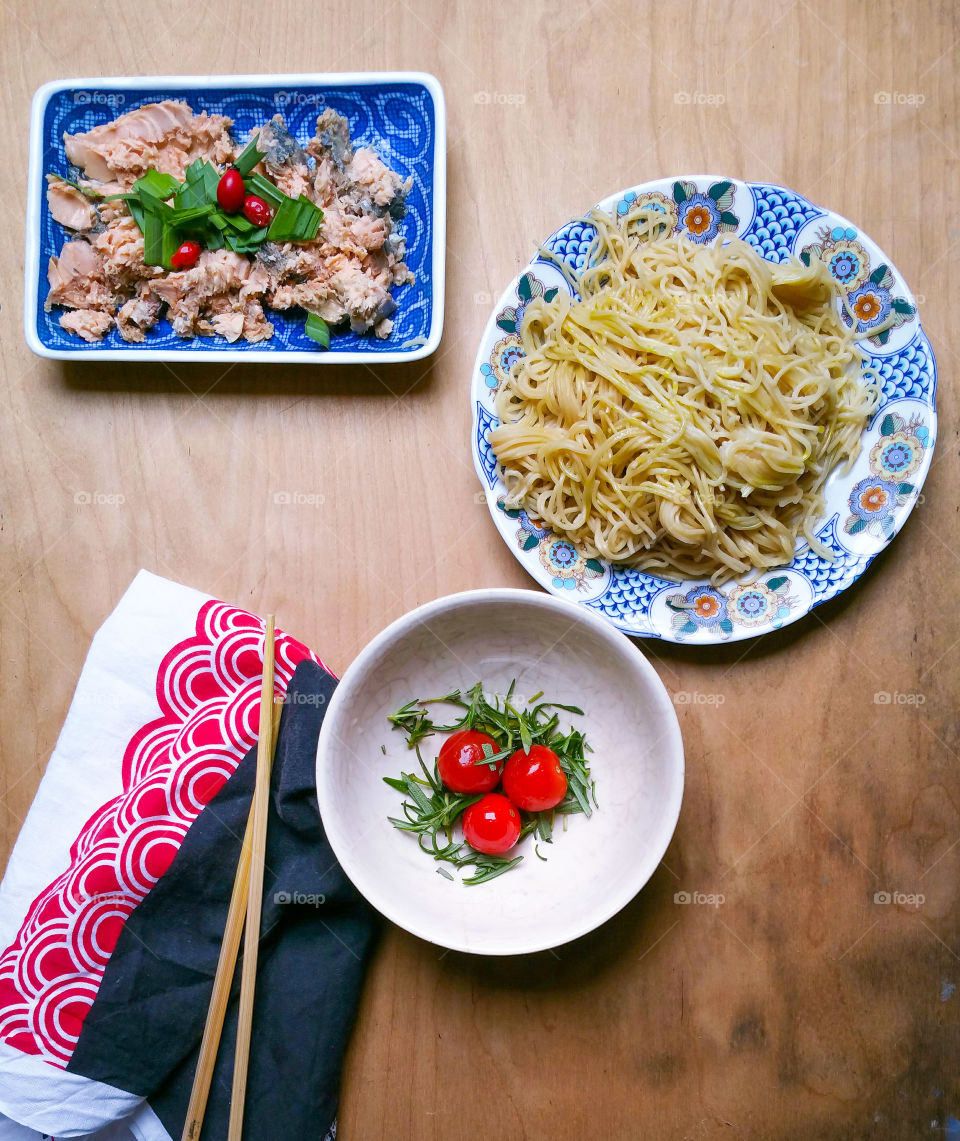 An oriental style lunch on wooden surface