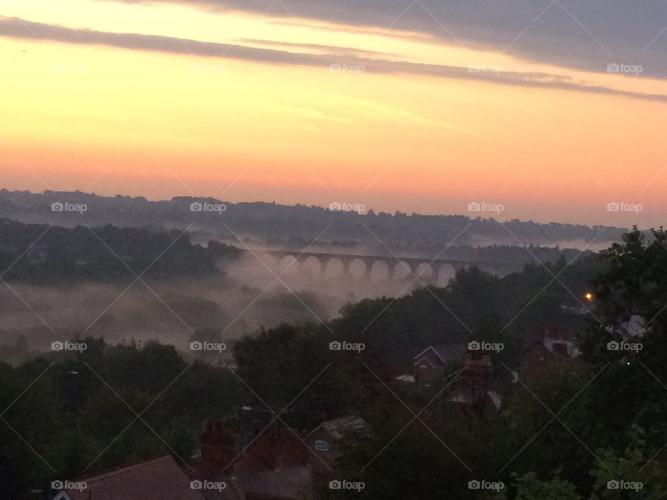 Misty morn. Viaduct in the early morning mist
