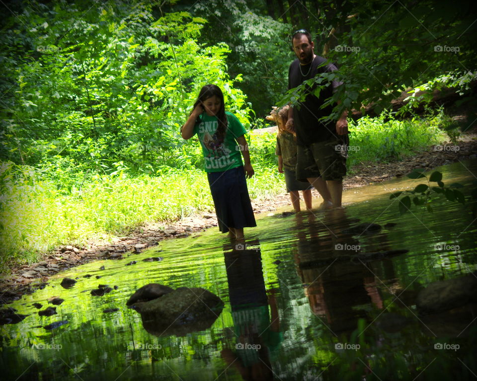 walking in the creek with daddy