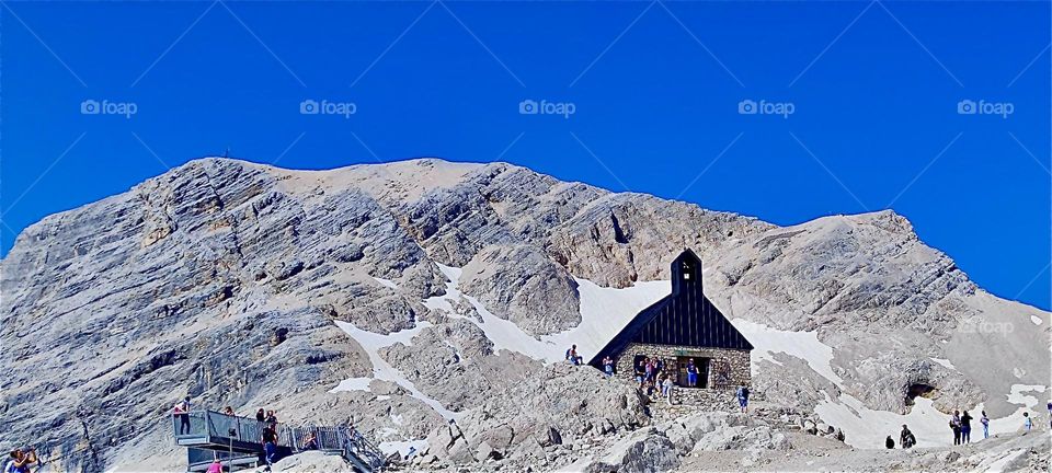 In the highest regions of Germany’s tallest mountain, the “Zugspitze” we find the “Mariä Heimsuchung”, “Visitation of Mary” chapel inaugurated in 1980 by “Joseph Cardinal Ratzinger” who later became “Pope Benedict XVI”. 2024. Hypnotic Productions