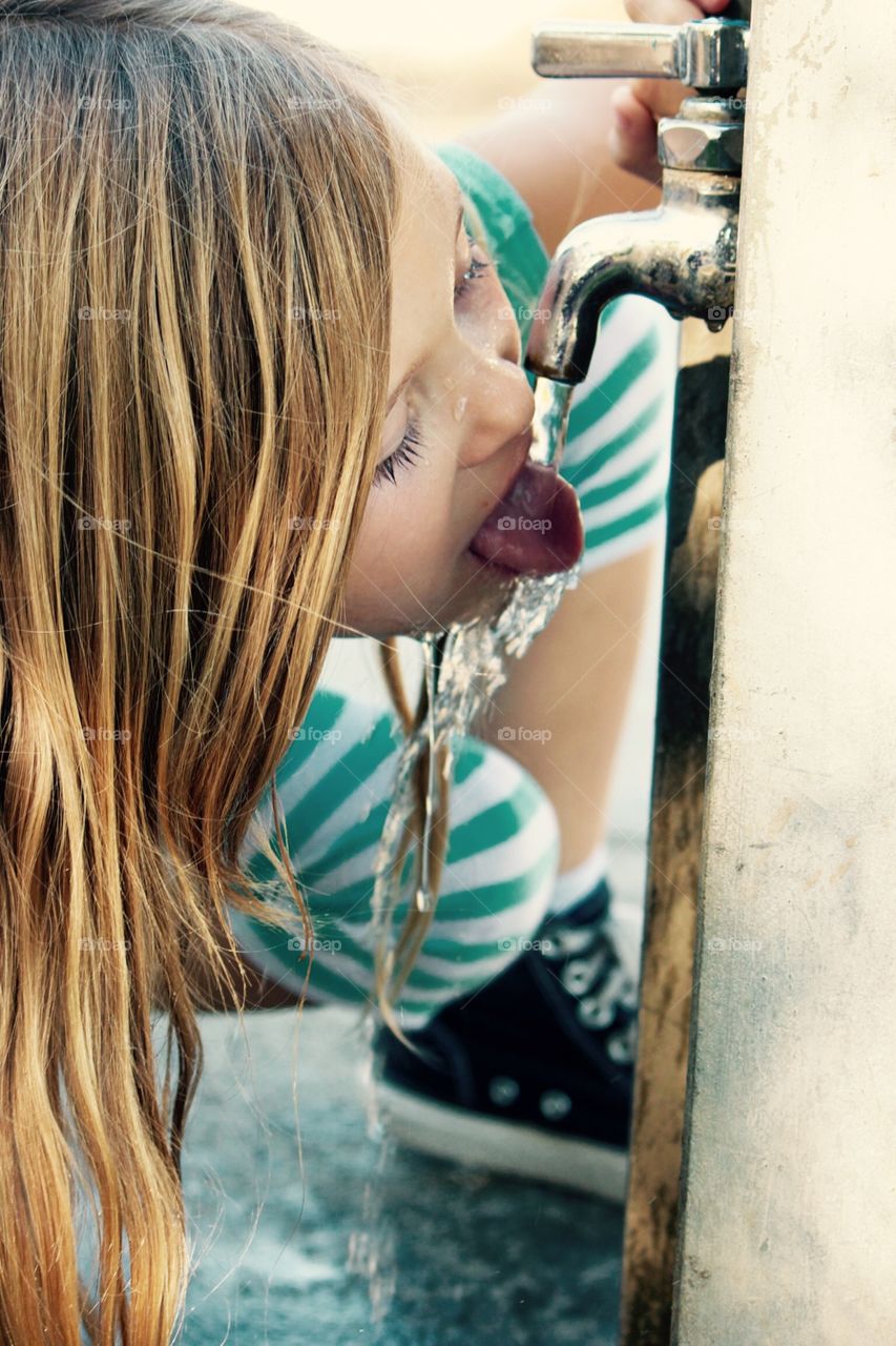 Drinking water in a fountain