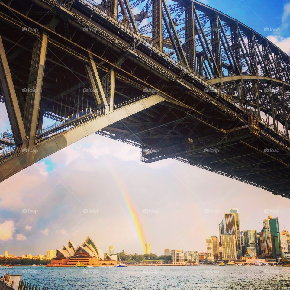 Directions to the pot of gold - rainbow under Sydney harbor bridge with the opera house too