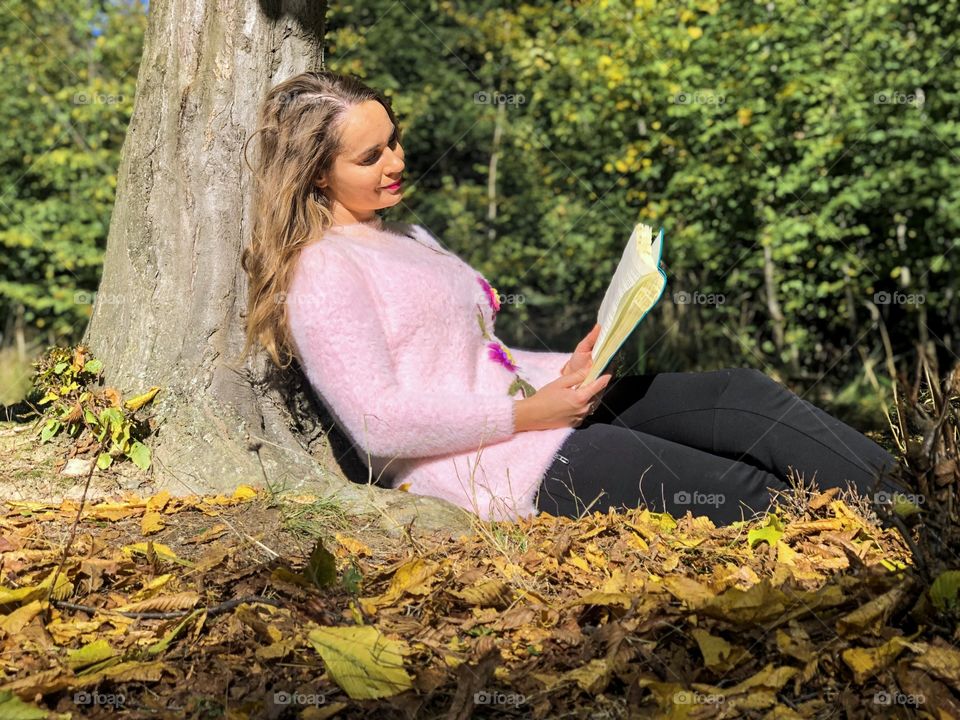 Reading under the tree