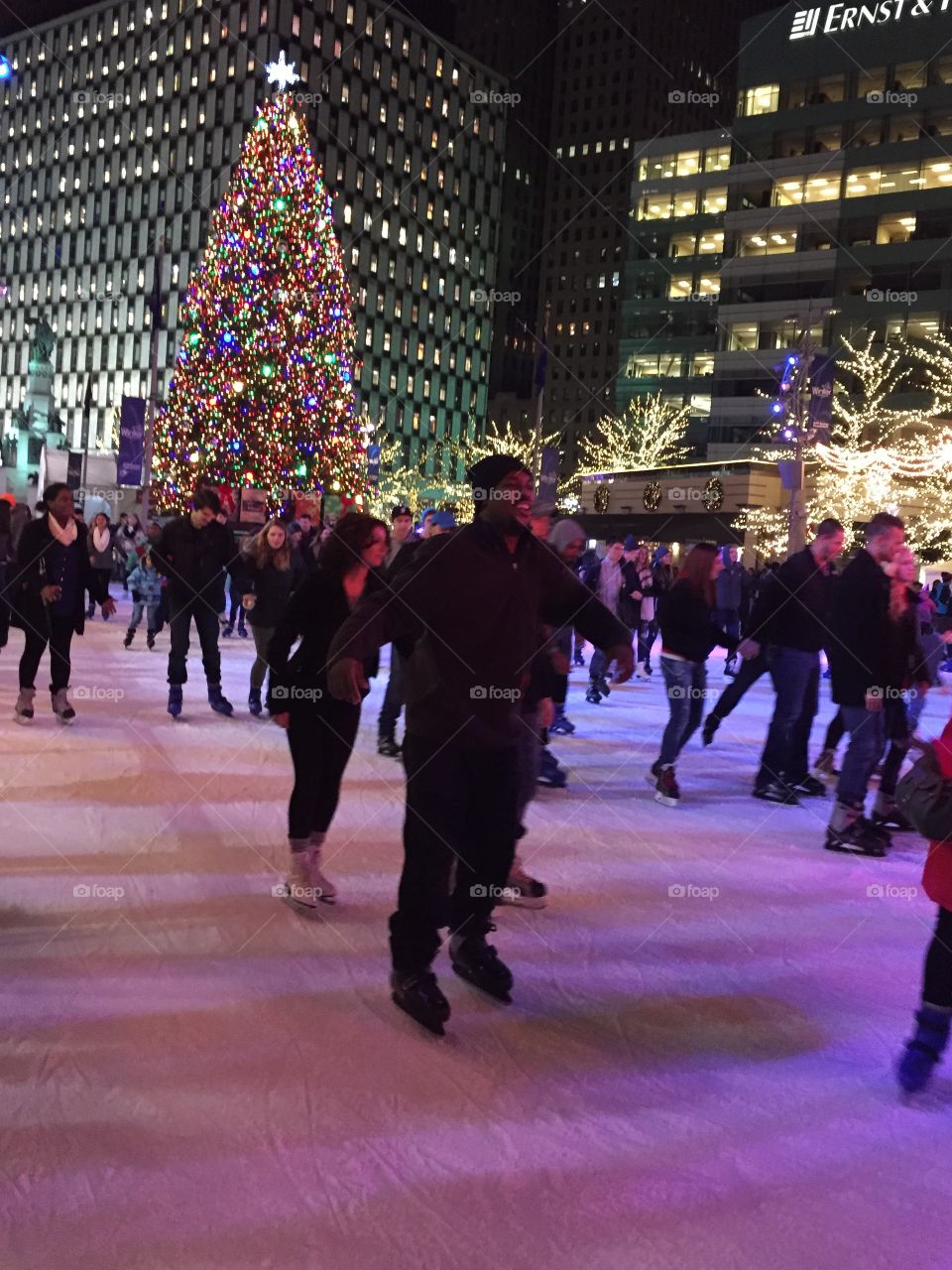 Group of people celebrating christmas at night