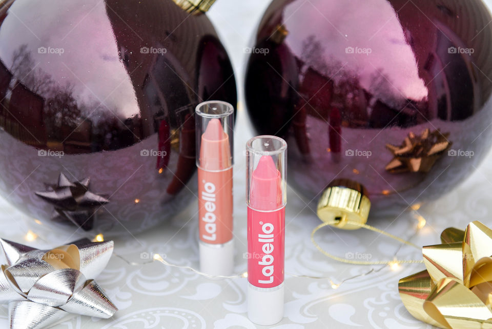 Labello lip crayons surrounded by Christmas decorations