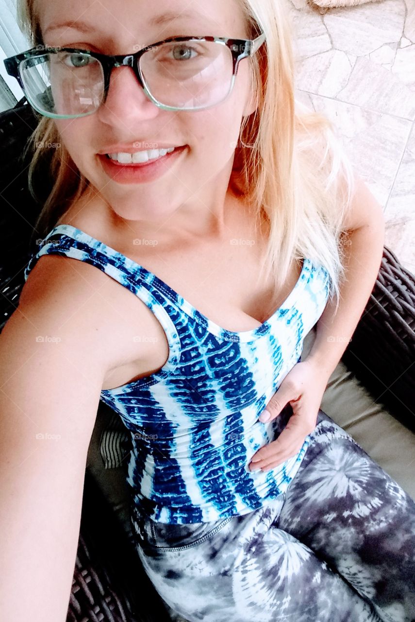 beautiful young skinny blond woman wearing glasses and work out clothes