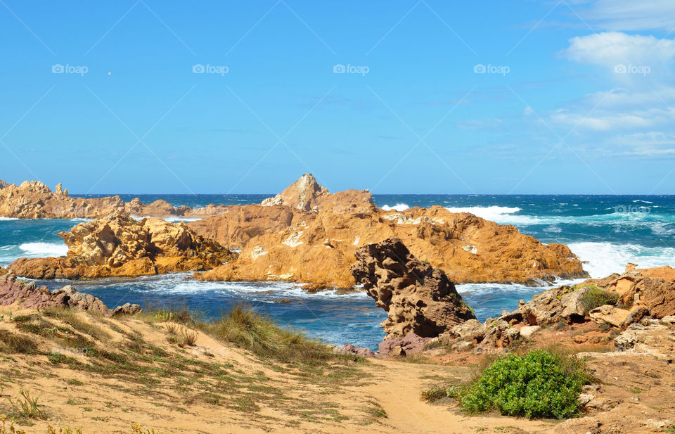 cliffs on the beach of menorca Balearic island in Spain