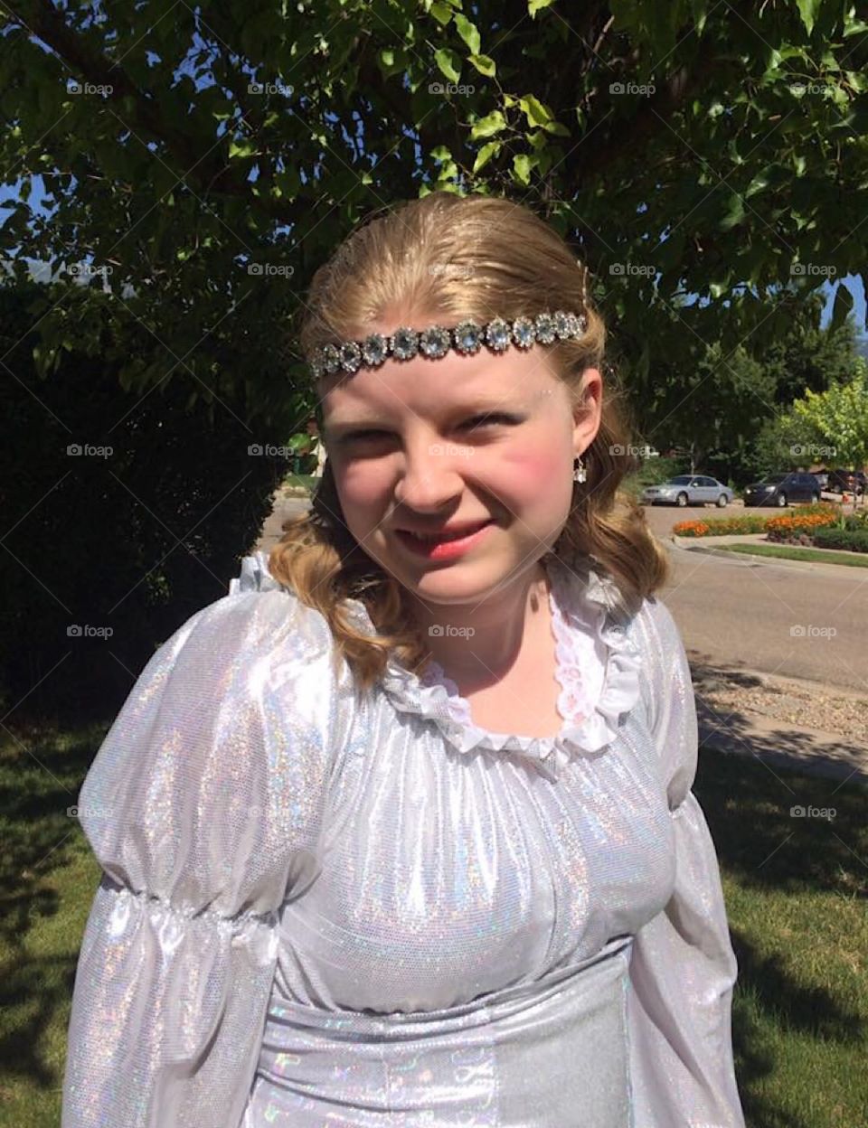 My lil’ poser in her silver fountain costume for summer theatre.