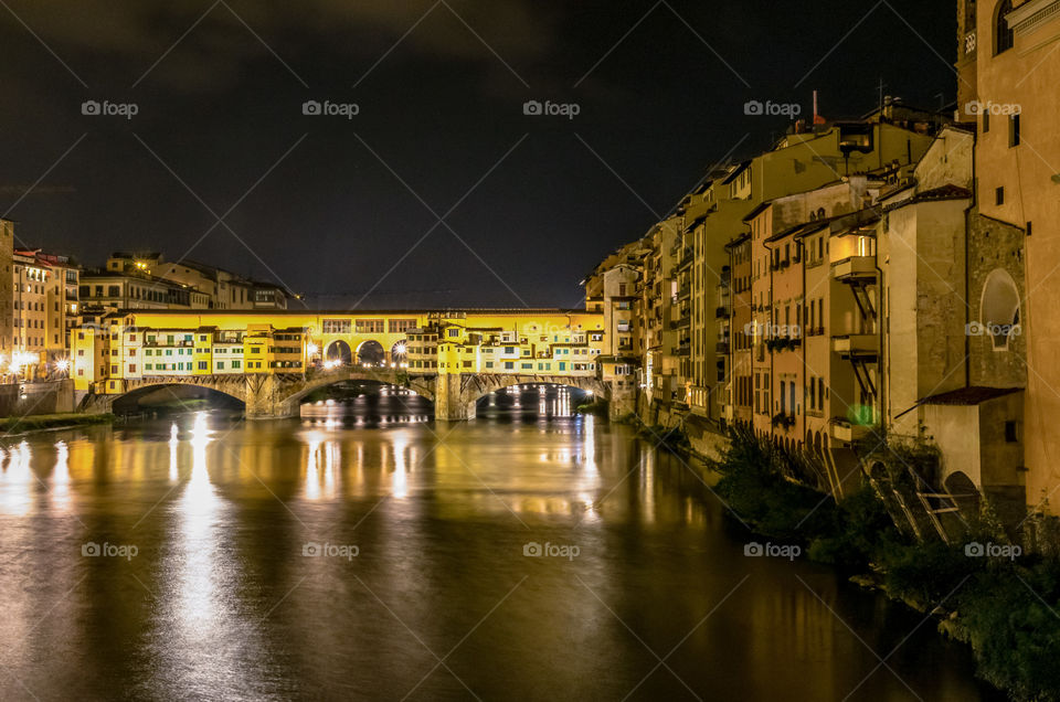 The Ponte Vecchio and Arno River in Florence at night 