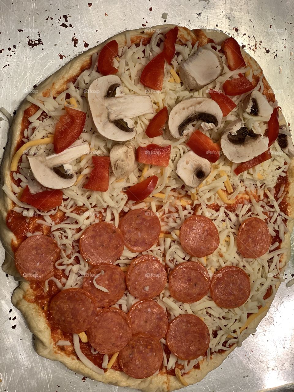 Homemade pizza before going in the oven