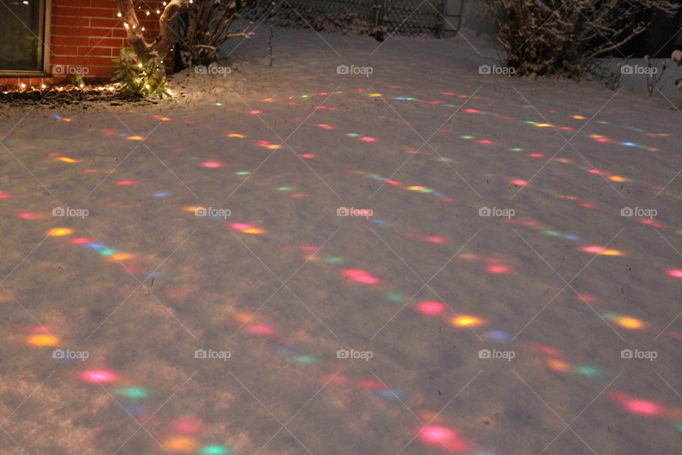 Christmas lights under the snow
